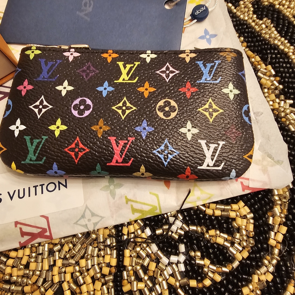 LV X TM Pochette Coin